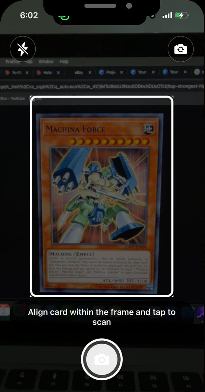 The scanner in Yu-Gi-Oh Card Scanner: a card held in the camera frame with the prompt to align the card within the frame and tap to scan